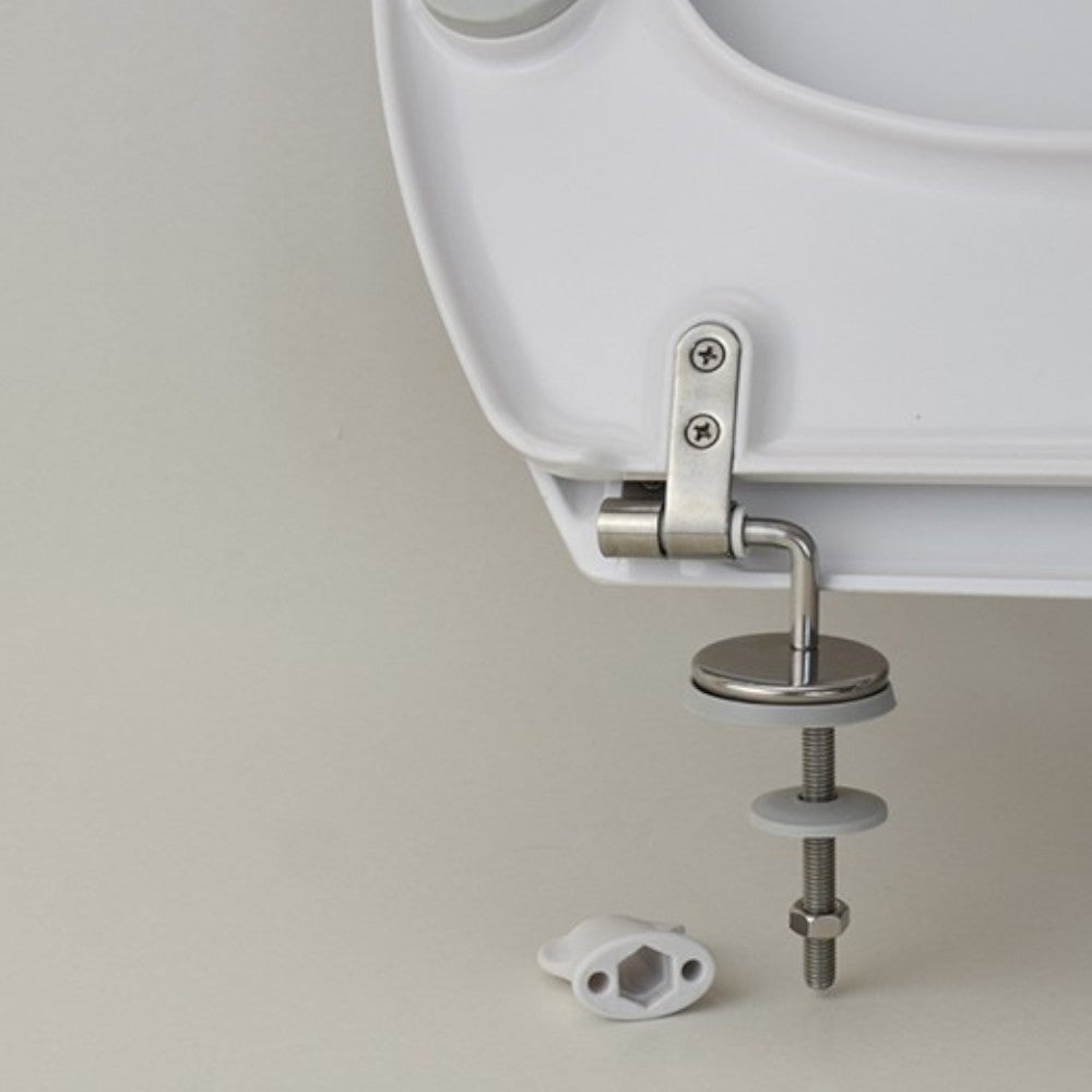 Sedile wc ergonomico universale per disabili in termoindurente bianco con apertura frontale e cerniere inox